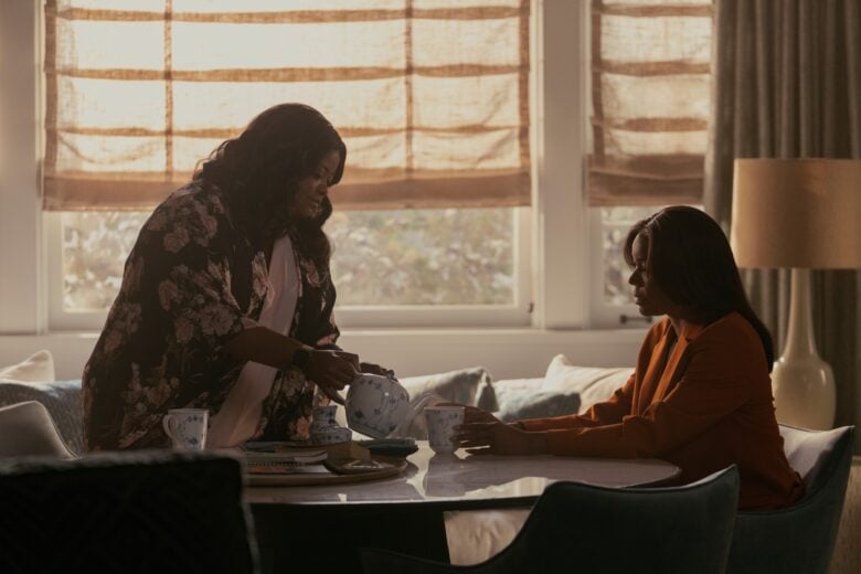 Poppy (played by Octavia Spencer, left) and Eva (Gabrielle Union) sit down for a cup of tea in a scene from Apple TV+ crime drama "Truth Be Told."
