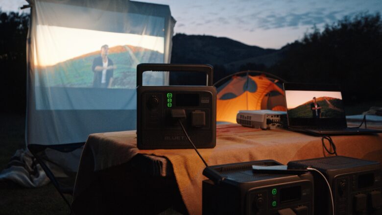 Bluetti AC60 powering a big screen video display in the great outdoors.