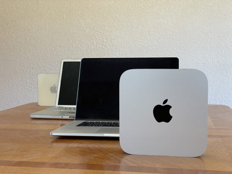 Four Macs sitting on a table