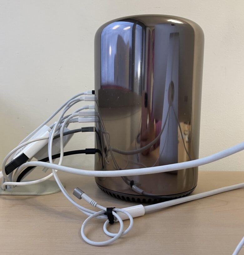BuddyA said he keeps the Mac Pro hidden behind the Cinema Displays because of that mess o' cables.