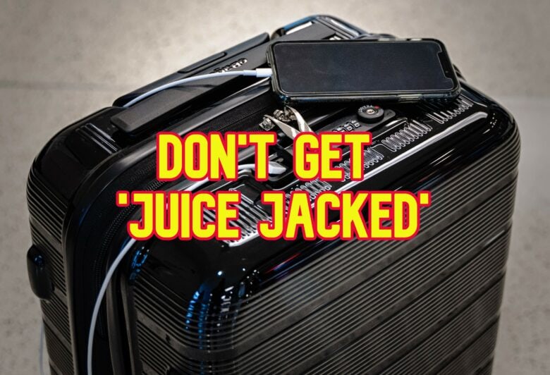 A suitcase with an iPhone charging on top and the words "don't get juice jacked."