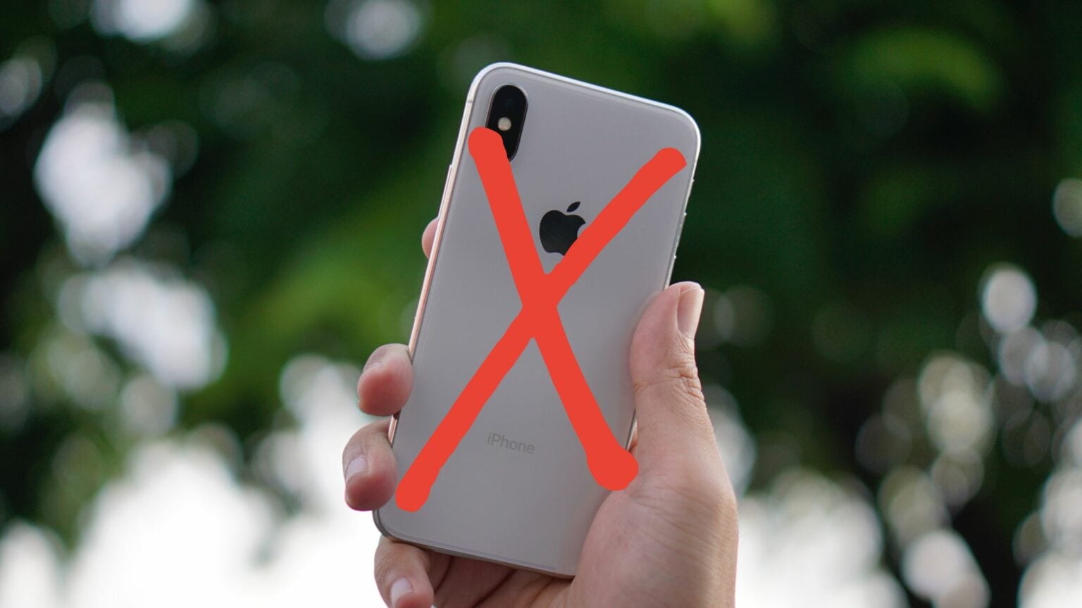 iPhone X with a red X sign on top.