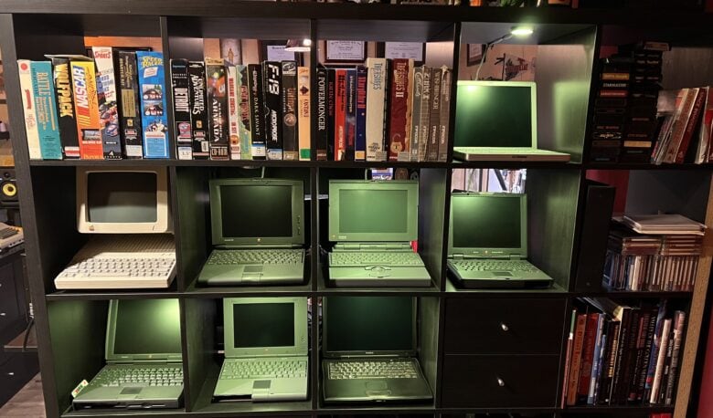 Not far from the modern setup, a rack of vintage Mac laptops and much more sit on display.