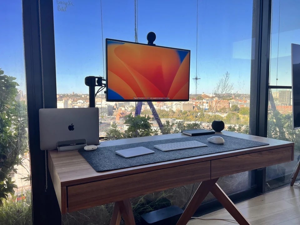 A 13-inch M1 MacBook Pro with a view drives a setup in Sydney, Australia.