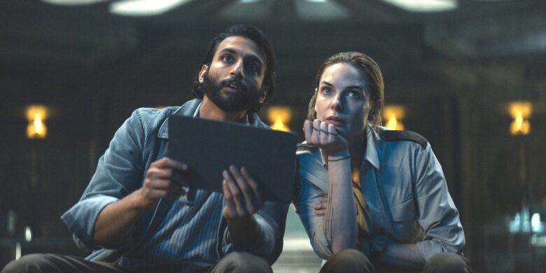 Avi Nash and Rebecca Ferguson in "Silo," now streaming on Apple TV+.