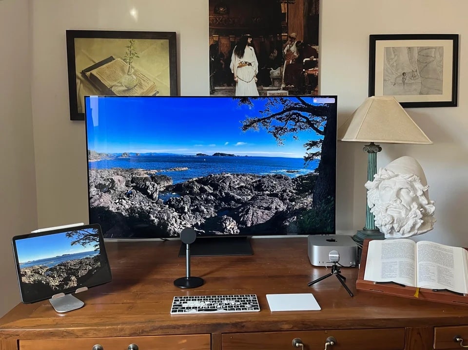 That 55-inch OLED smart TV may be far enough away because the desk is 40 inches deep and the user said he tends to lean back a bit.