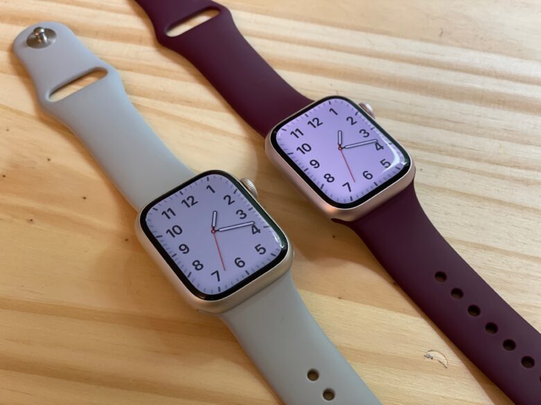 Silver Apple Watch next to Pink Apple Watch
