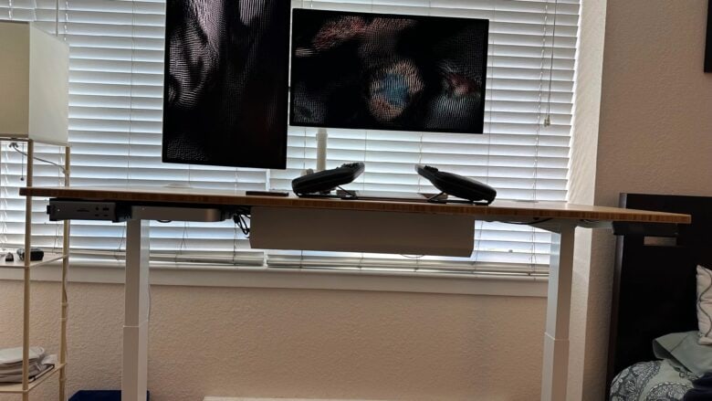 Strange keeps the desk tidy by mounting M2 Mac mini and docks underneath it. 