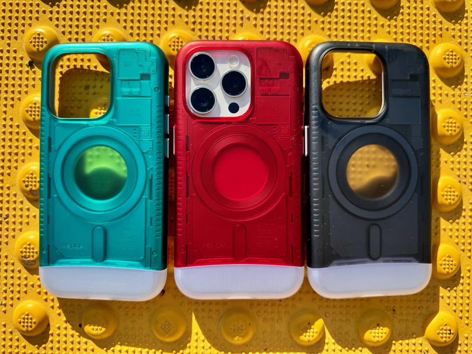 Three of Spigen's limited-edition Classic C1 MagFit cases, inspired by 1998's iconic iMac G3.
