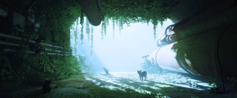 Screenshot of Stray opening scene with bright dynamic lighting with cats sitting in some kind of cave.