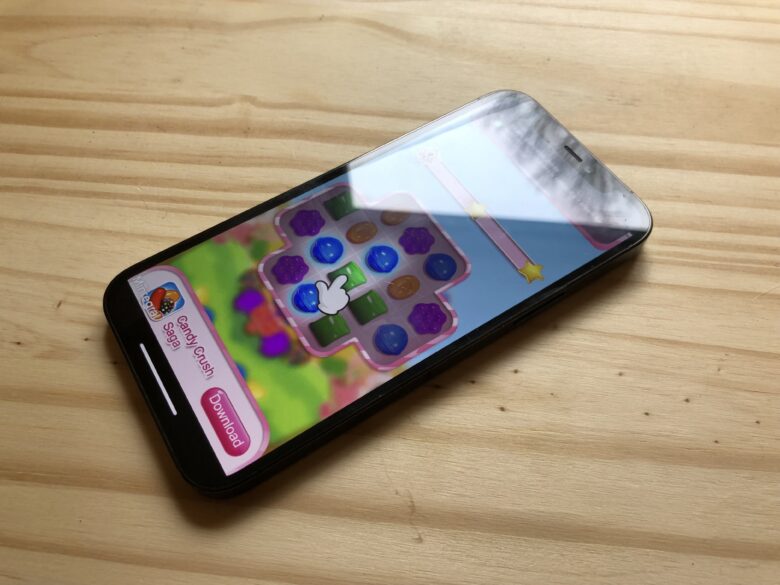 Picture of an iPhone showing a full-screen mobile game advertisement