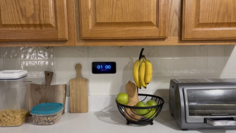 Kitchen with iPhone clock on the wall