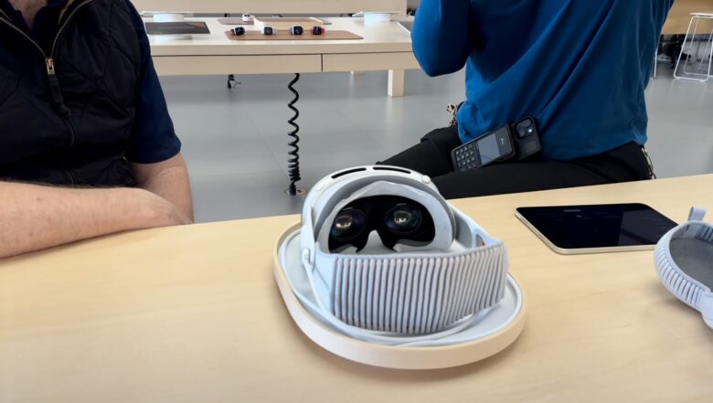 Apple Vision Pro on a wood platter during demo at an Apple retail store.