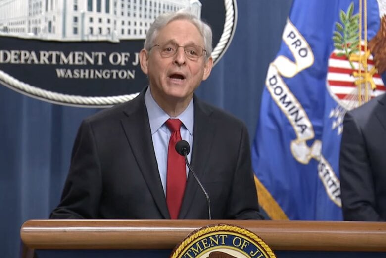 Attorney General Merrick Garland at. press conference announcing a major antitrust lawsuit against Apple for monopolizing smartphone markets.