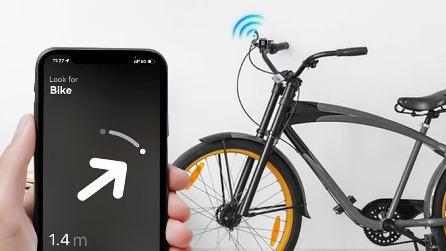 A person locating a bicycle that has a Find My-based bike tracker hidden in its bell, using a mobile app.