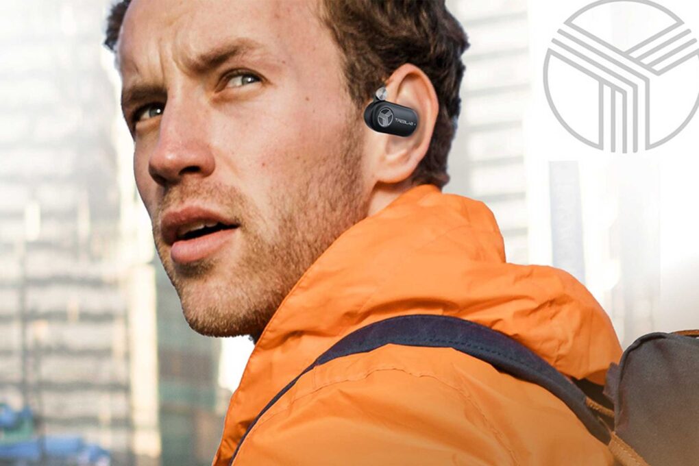 Photo of a man wearing Treblab X-Open earbuds