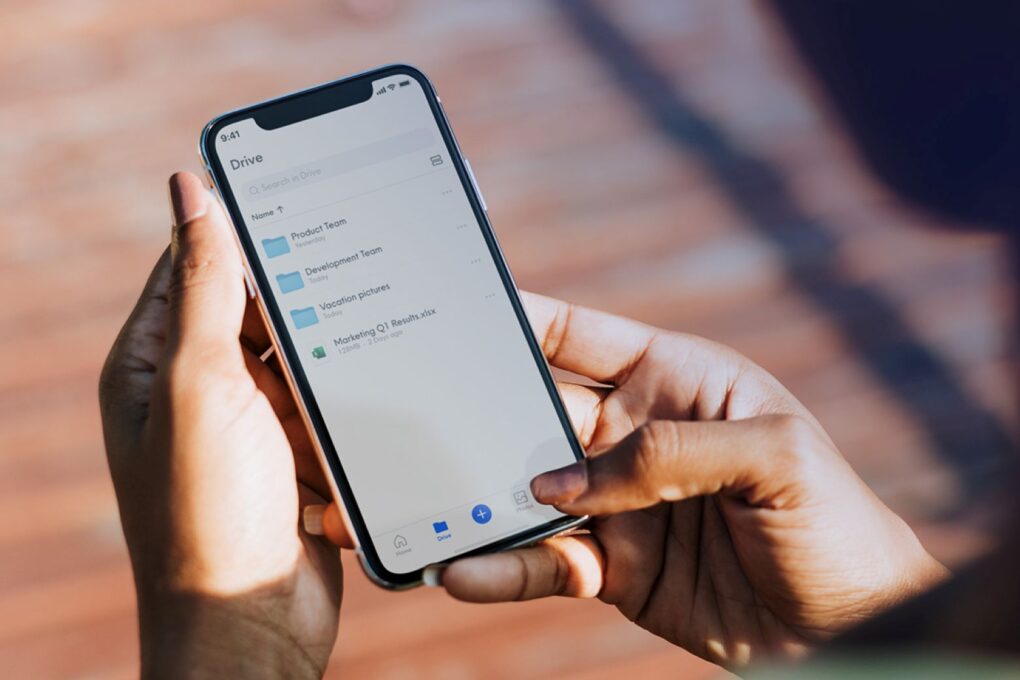 Photo of person accessing Internxt cloud storage on an iPhone.