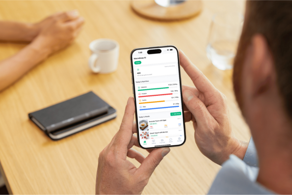 Man using MacroSnap macro tracker app on an iPhone