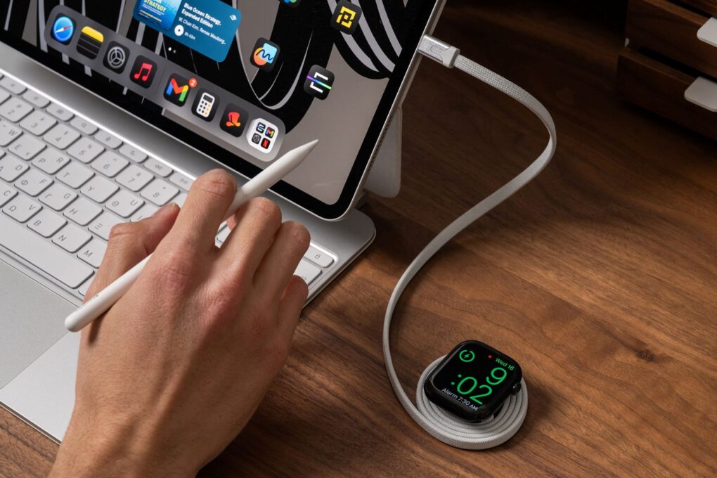 Apple watch being charged through a Statik MagStack Slim for Apple Watch charger cable that is attached to an iPad.
