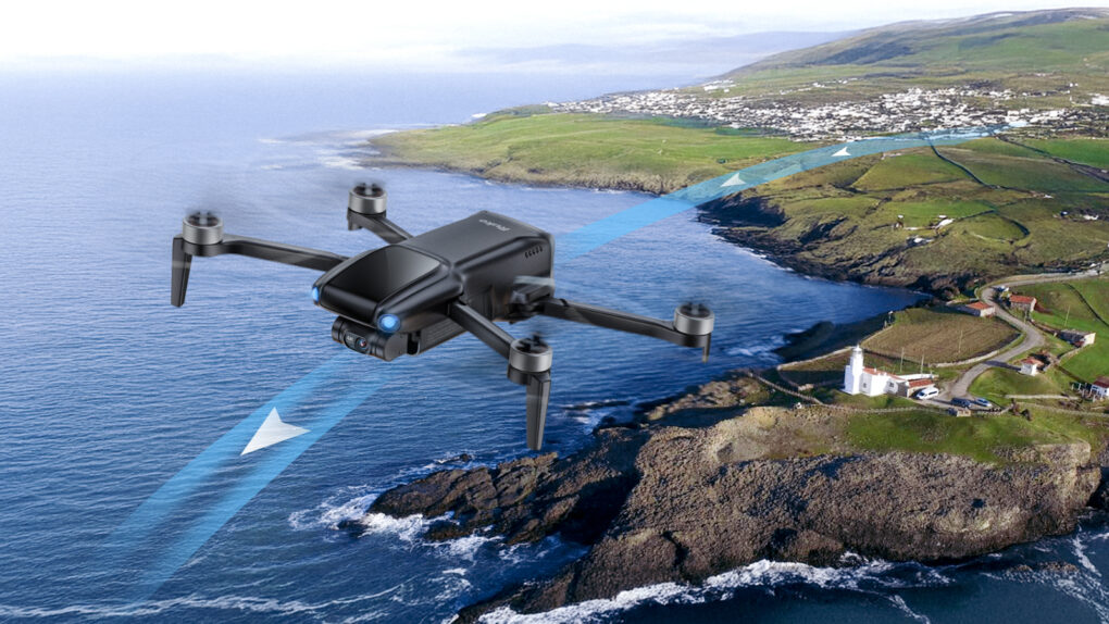 Photo of Ruko U11mini 4K drone flying over a body of water toward land.