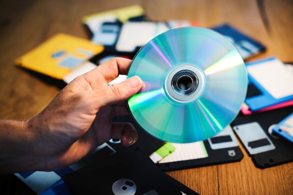 Person about to load a disc into a DVD ripper.