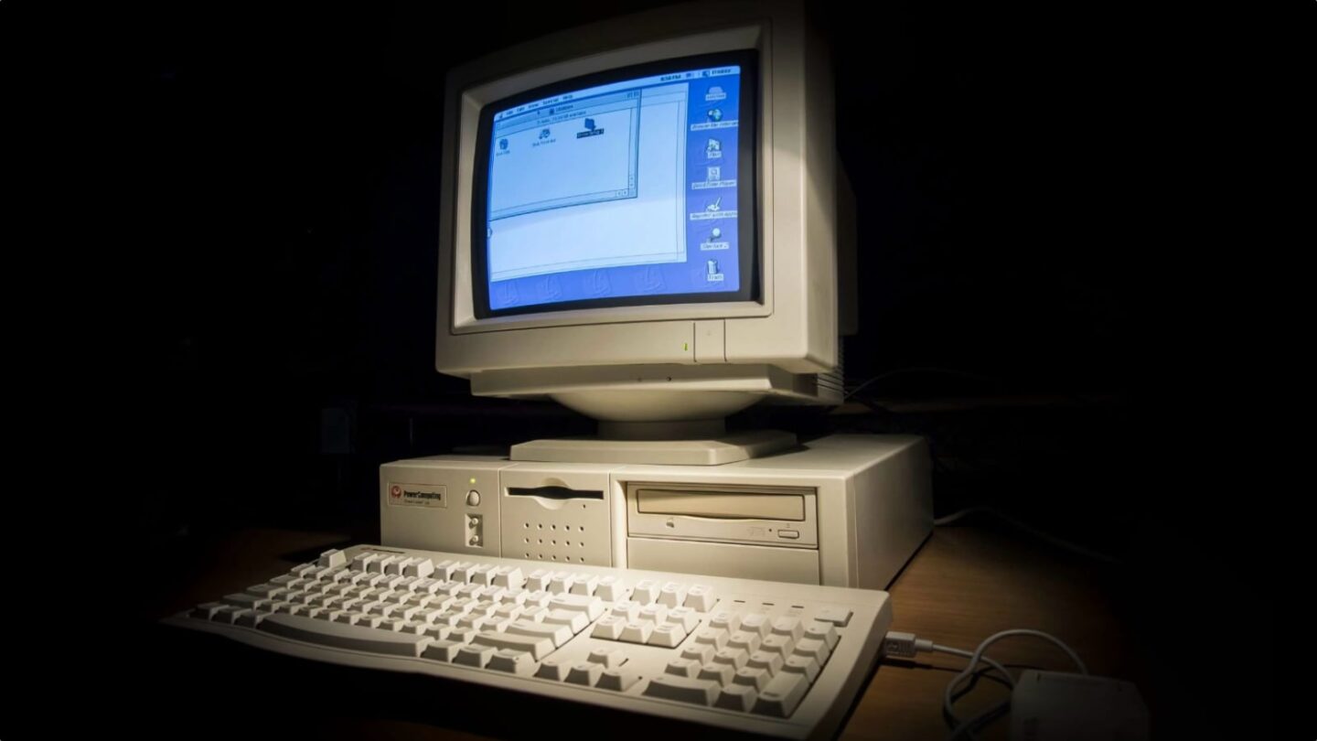 Photo of a Power Computing clone Mac with keyboard and a dark background
