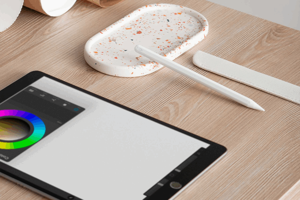 Photo of a Tinymoose Pencil Pro Plus stylus pen for iPad next to an iPad