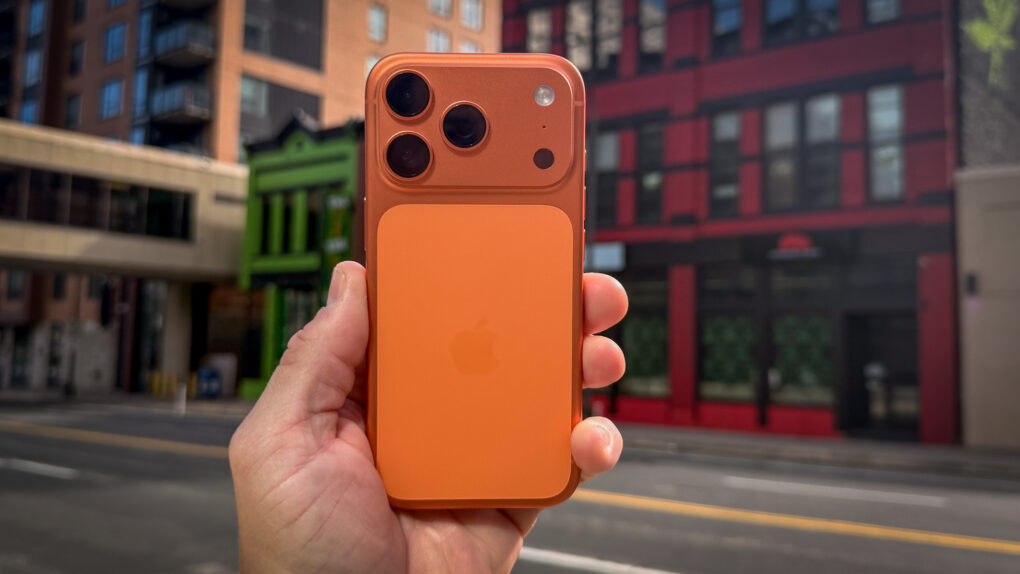 iPhone 17 Pro with brightly colored buildings in the background