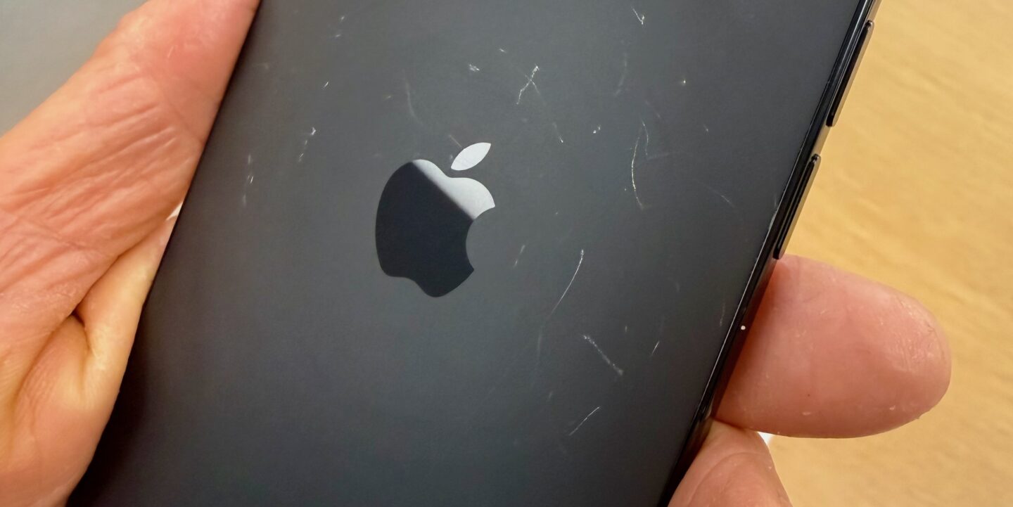 The back of a demo unit iPhone Air showing extensive scratches.