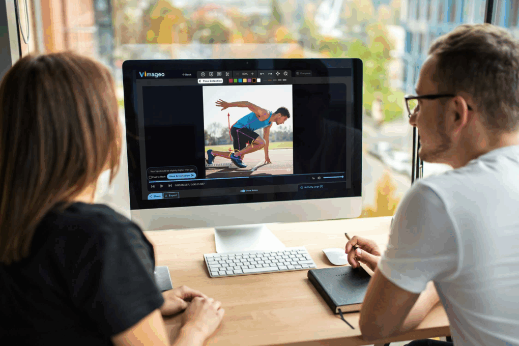 Two people discussing a video on a Mac using the Vimageo image collaboration platform.