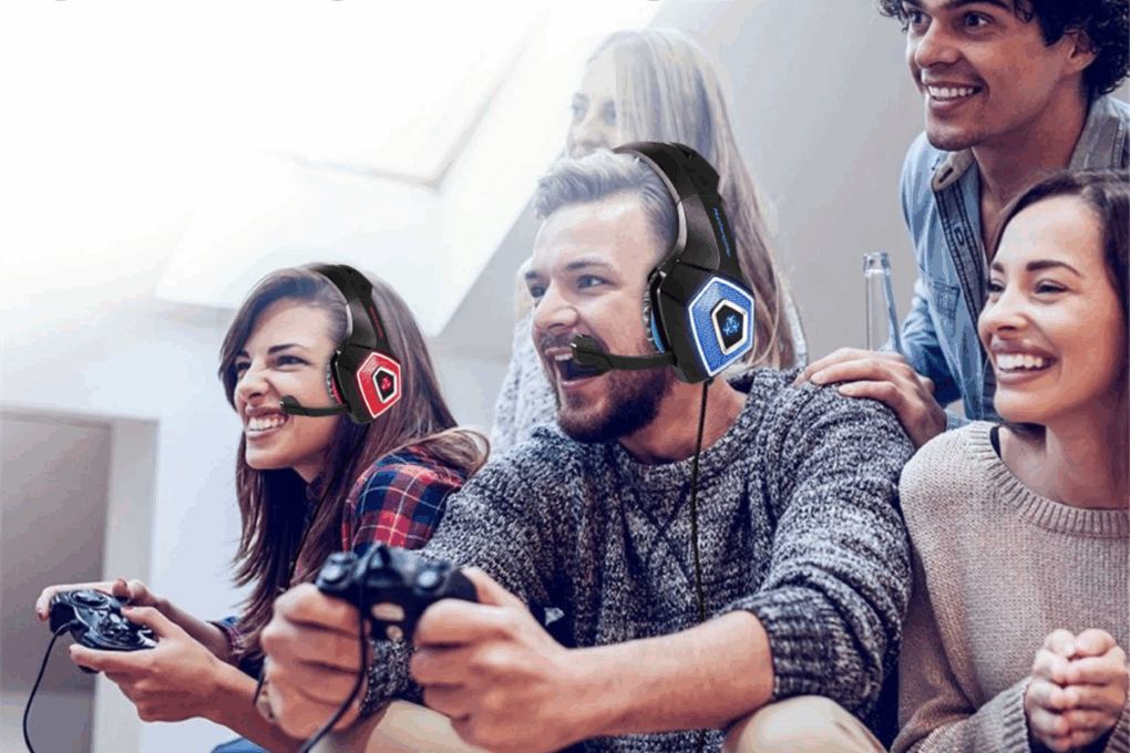 A group of people enjoying a console game with two wearing Dragon G3X gaming headsets
