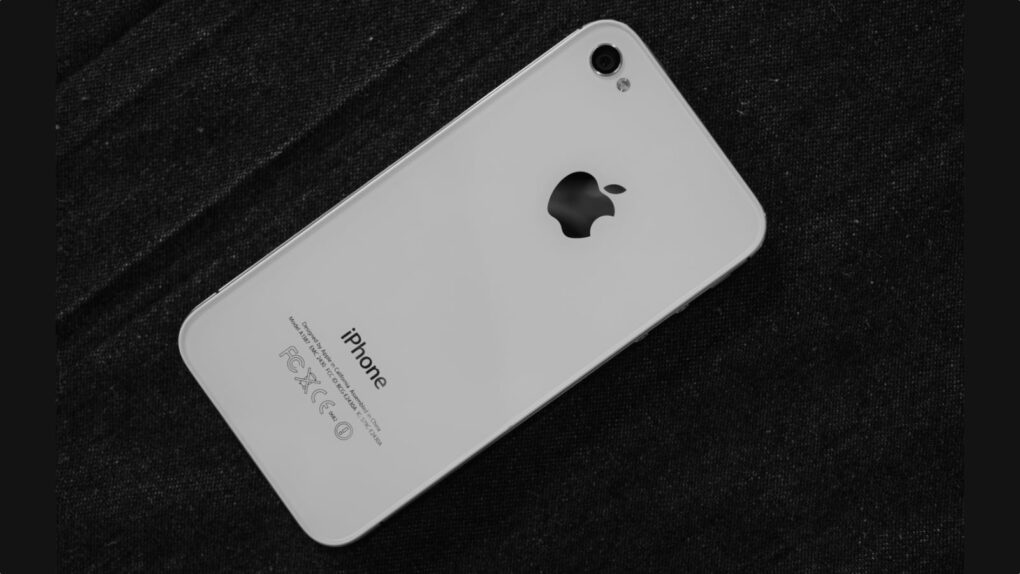 Photo of the back of an iPhone 4s, shown on a black background