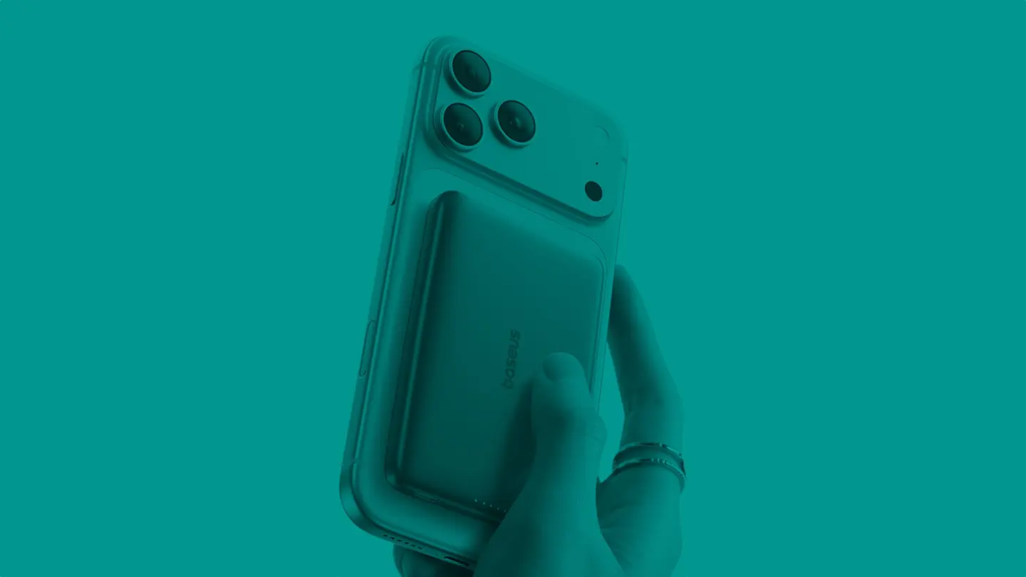 Photo of hand hodling iPhone 17 Pro with a Baseus Picogo Qi2 10K Portable Charger to illustrate guide to best iPhone accessories deals for Black Friday 2025