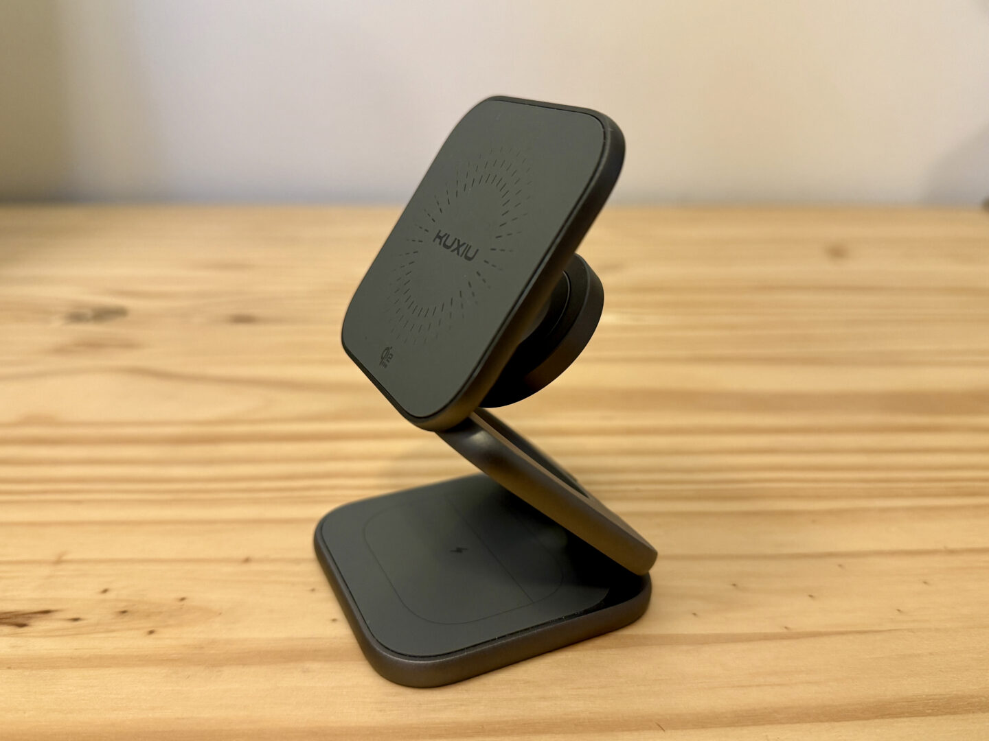 Kuxiu X40 Turbo sitting unfolded on a pine table