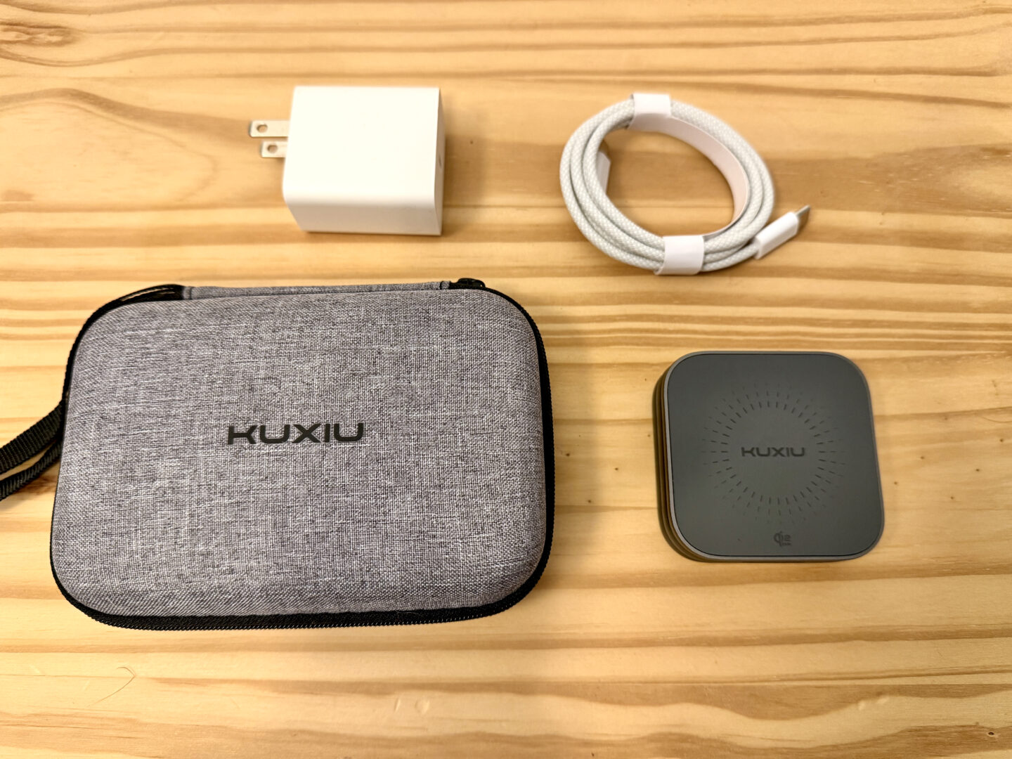 Kuxiu X40 Turbo, its power adapter, USB-C cable and travel case.