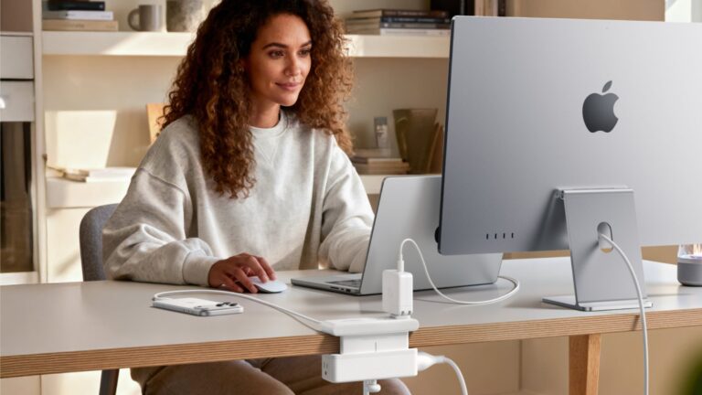 Photo of woman using iMac and Anker chargers, including new models released at CES 2026.