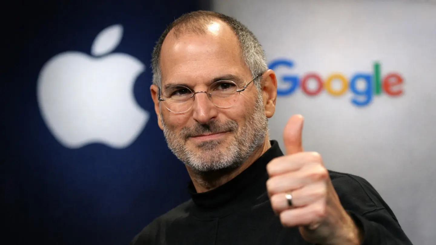 An AI image of Apple co-founder Steve Jobs giving a thumbs up in front of Apple and Google logos, used to illustrate an opinion piece about how he would have approved building Google's Gemini AI into Siri.