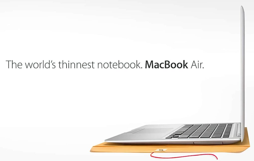 Apple advertisement showing a laptop sitting on a manila envelope, with the words, 