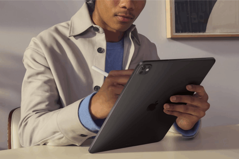 Man writing on a refurbished iPad Pro with an Apple Pencil