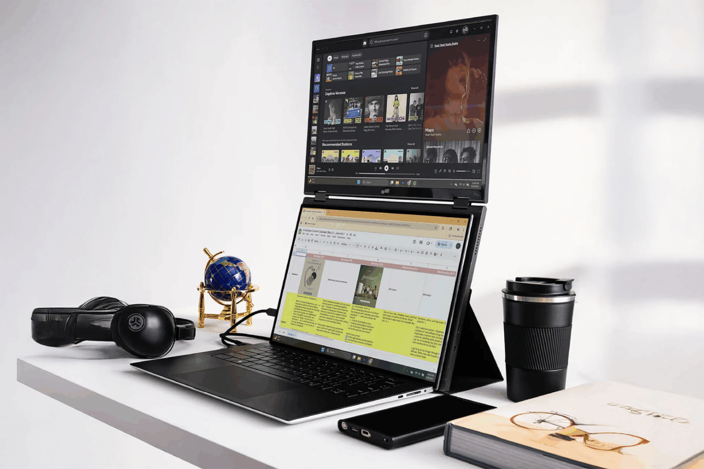 A work desk with Mobile Pixels Duex Float 2 Pro secondary monitor stacked on a laptop