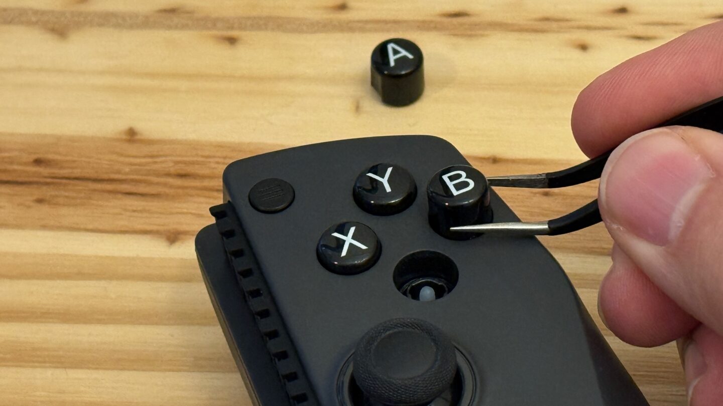 GameSir X5s Button Swapping Swapping out the A and B buttons on a GameSir X5s controller with tweezers