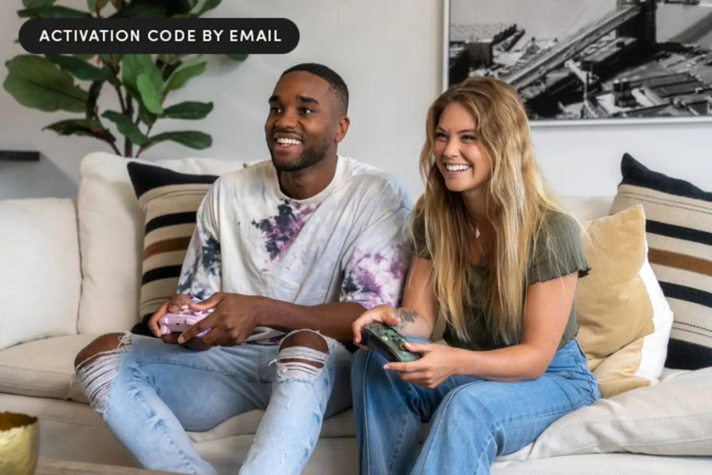 Photo of a man and woman on the couch playing games with an Xbox Game Pass Ultimate discount subscription