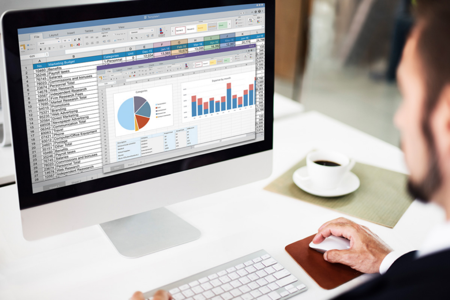 A man using Microsoft Excel on a PC as part of his Microsoft 365 subscription