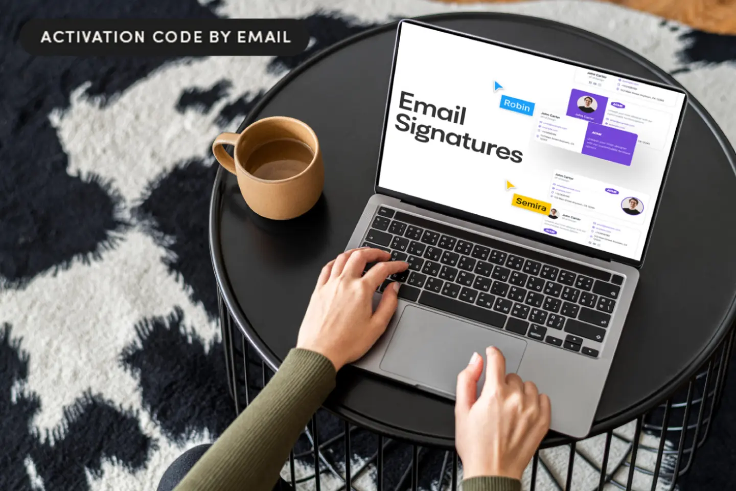Custom email signature generator EmailSignatures is shown on a laptop being used by a person sitting at a coffee table