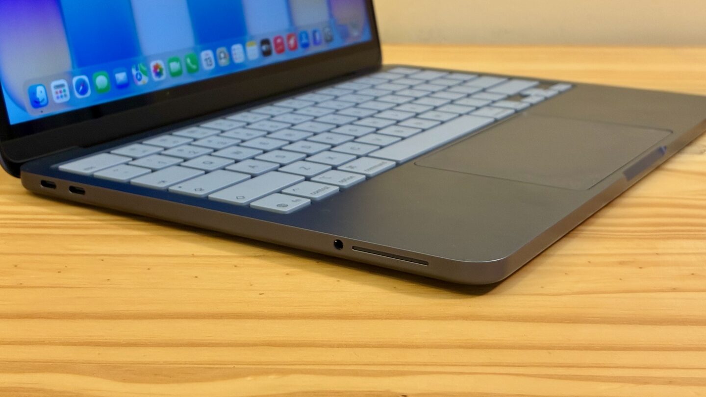 Closeup of the speaker on an Indigo MacBook Neo