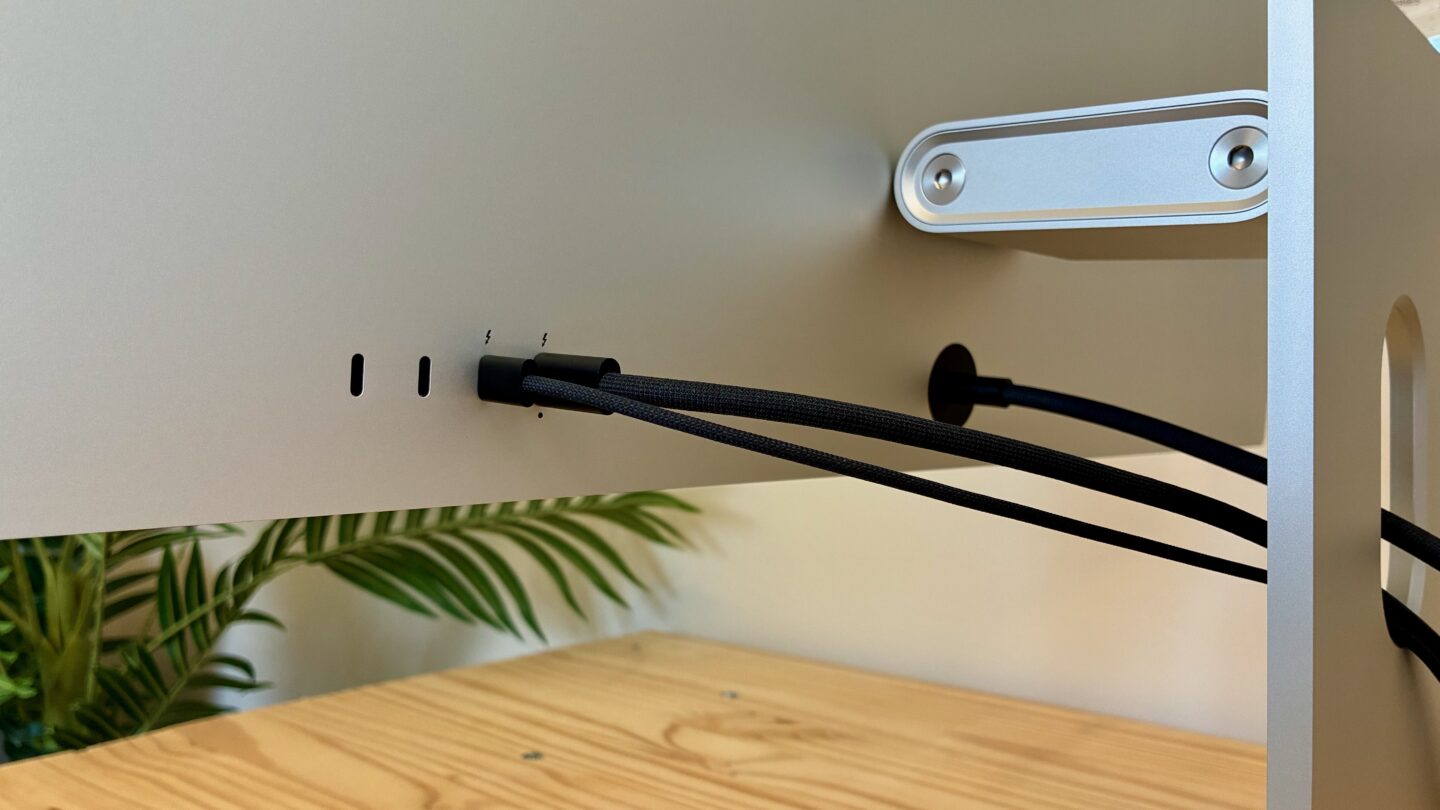 Studio Display Ports Ports on the back of the Studio Display XDR, two USB-C and two Thunderbolt 5, with two cables plugged in