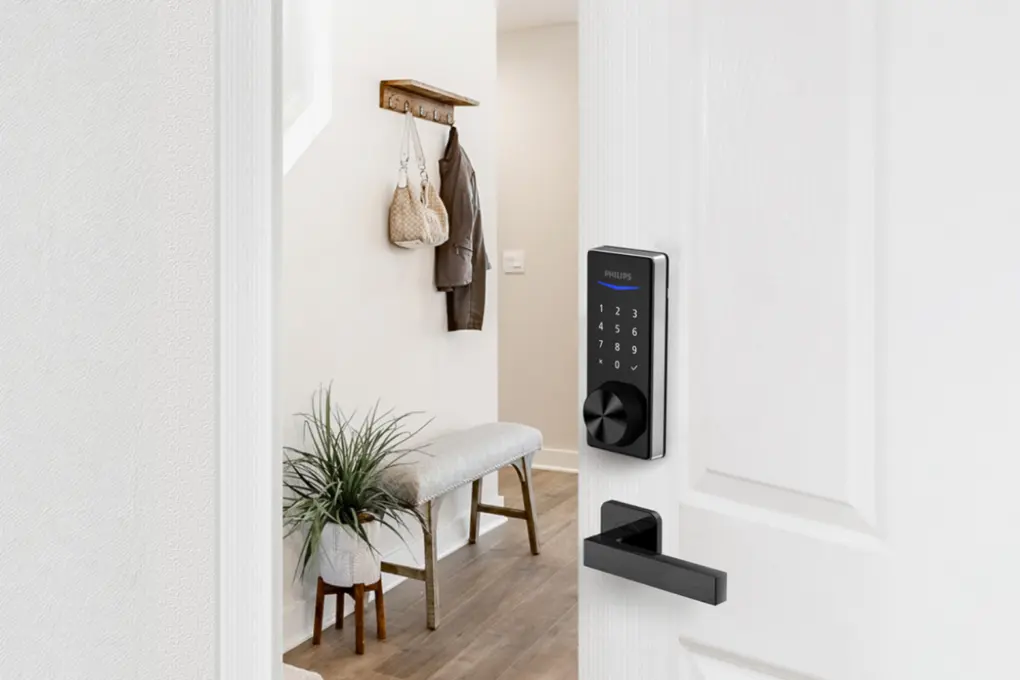 An opened door with a Philips 1000 series touchscreen deadbolt
