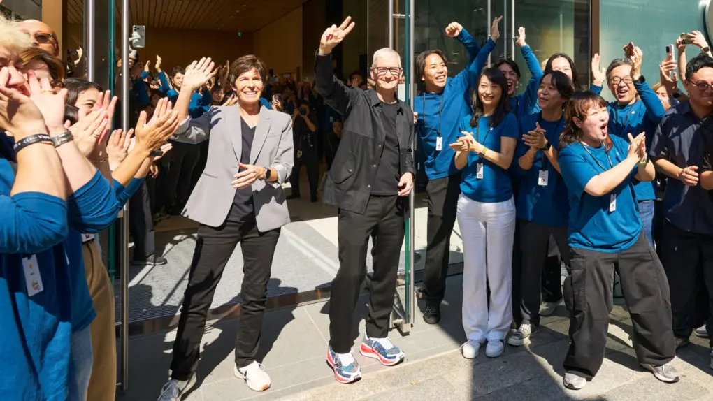 Apple execs Deirdre O'Brien and Tim Cook greet fans at the opening of Apple Ginza in 2025.