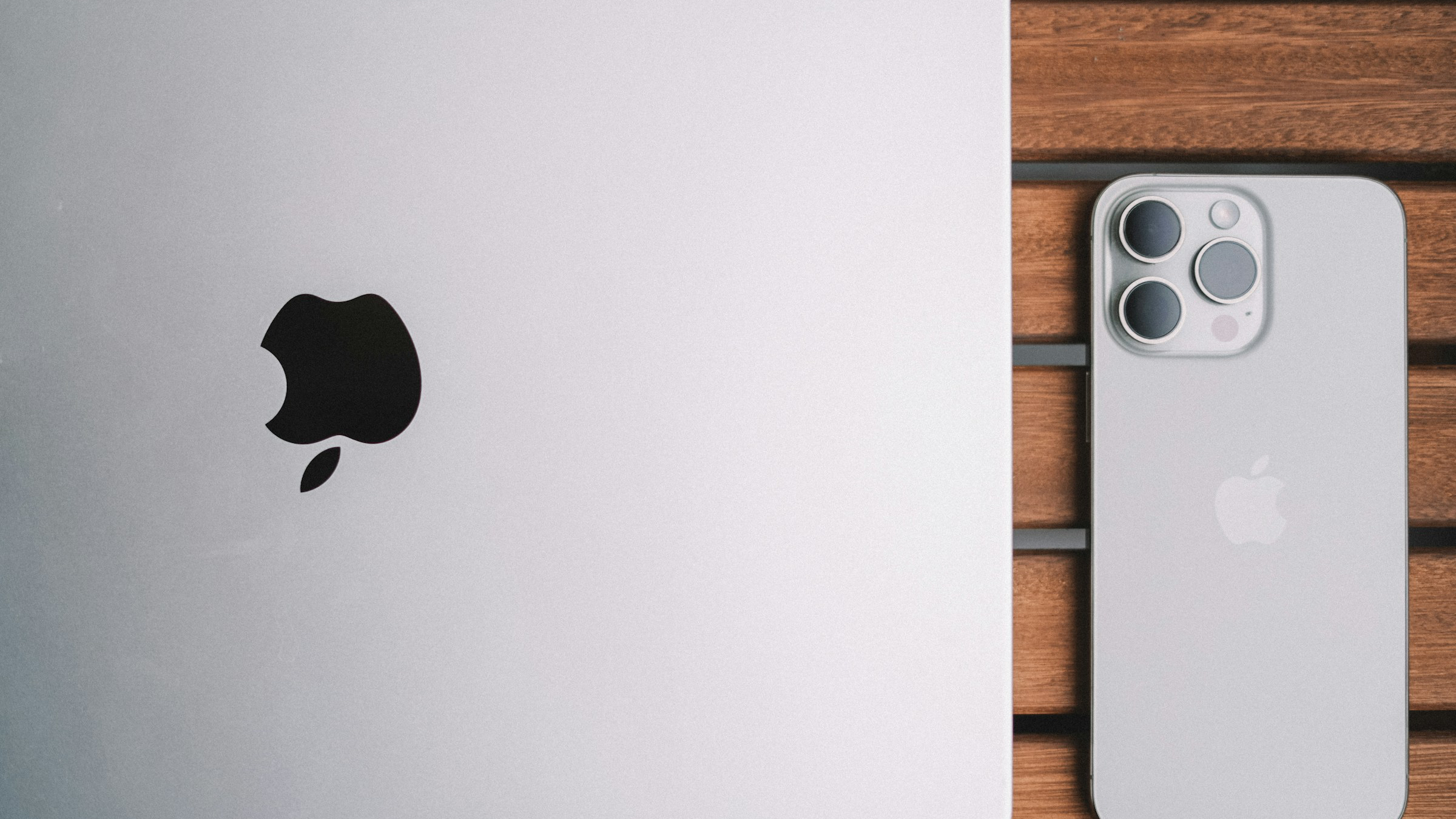 MacBook and iPhone together on a desk
