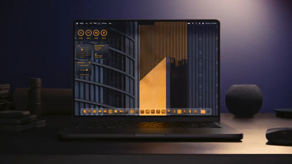 A MacBook Pro with a black and orange wallpaper and orange icons